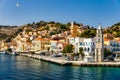 View of the beautiful greek island of Symi Simi with colourful houses and small boats. Greece, Symi island, view of the town of Royalty Free Stock Photo