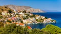 View of the beautiful greek island of Symi (Simi) with colourful houses and small boats. Royalty Free Stock Photo