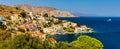 View of the beautiful greek island of Symi (Simi) with colourful houses and small boats. Greece, Symi island, Royalty Free Stock Photo