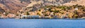 View of the beautiful greek island of Symi (Simi) with colourful houses and small boats. Greece, Symi island Royalty Free Stock Photo