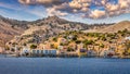 View of the beautiful greek island of Symi (Simi) with colourful houses and small boats. Greece, Symi island Royalty Free Stock Photo