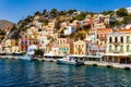 View of the beautiful greek island of Symi (Simi) with colourful houses and small boats. Greece, Symi island Royalty Free Stock Photo