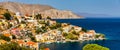 View of the beautiful greek island of Symi (Simi) with colourful houses and small boats. Greece, Symi island Royalty Free Stock Photo
