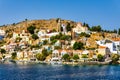 View of the beautiful greek island of Symi (Simi) with colourful houses and small boats. Greece, Symi island Royalty Free Stock Photo