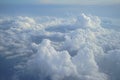 View of beautiful heaven cloudscape with shades of blue sky background from flying plane window Royalty Free Stock Photo