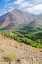 View on beautiful High Atlas Mountains landscape with lush green valley and rocky peaks, Morocco, North Africa Royalty Free Stock Photo