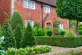 The view of a beautiful house exterior with garden and front door in England Royalty Free Stock Photo