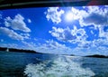 View of a  beautiful lake on a sunny day with clouds in the sky. Royalty Free Stock Photo