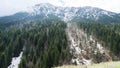 View of beautiful landscape in the Montenegro border with Bosnia with green forest and snow-capped mountain tops in the background Royalty Free Stock Photo