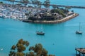 View of beautiful marina from above with large beautiful sailboat in beautiful blue lagoon.