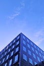 View of a beautiful modern building against the blue sky. Royalty Free Stock Photo