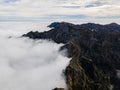View of beautiful mountain landscape above the clouds of Madeira Island - Green mountain landscape with view above the Royalty Free Stock Photo