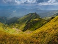 View of beautiful mountains panoramic landscape of a rocky cliffs and green hills. Royalty Free Stock Photo