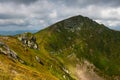 View of beautiful mountains panoramic landscape of a rocky cliffs and green hills. Royalty Free Stock Photo