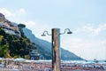 View of a beautiful, new, beach shower on the beach. Mountains in the background. Glossy stainless steel products. Chrome and Royalty Free Stock Photo