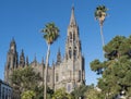 View on beautiful parish church of San Juan Bautista, impressive Neogothic Cathedral in Arucas, Gran Canaria, Spain. Blue sky and Royalty Free Stock Photo