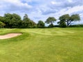 A view of a beautiful parkland golf golf surrounded by trees, in Scotland