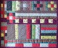 View of beautiful patchwork quilt