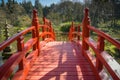 View on a beautiful red bridge in a park Royalty Free Stock Photo