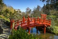 View on a beautiful red bridge in a park Royalty Free Stock Photo