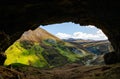 A view of a beautiful remote Scottish landscape from inside of a cave.