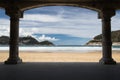 View on beautiful sandy beach la concha of san sebastian through under arch arcade, basque country, spain Royalty Free Stock Photo