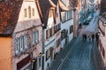 View of a beautiful street with traditional German houses in Rothenburg ob der Tauber in Germany. European city. Royalty Free Stock Photo