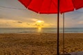 View of the beautiful sunset above beach at Koh Lanta island, Thailand. Look from the shadow of beach umbrella. Vibrant and soft Royalty Free Stock Photo