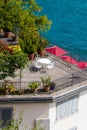 View of beautiful table with white chairs stands on the balkon. Decoration from flowers. Location for her morning photo session Royalty Free Stock Photo