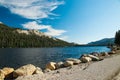 View of the beautiful Tenaya Lake with granite peaks and pine trees in the background. Tioga Pass in Yosemite National Park,