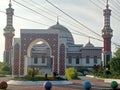 The view of the beautiful three-story mosque is beautiful and there is a gate to enter the mosque