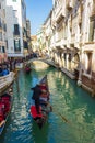 View of Venice canal Rio del Palazzo gondolas and crowded bridge Italy