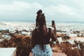 Black girl photographing a cityscape Royalty Free Stock Photo