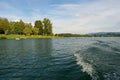 View behind from the cruising boat and waves made by the boat, Zermanice reservoir Royalty Free Stock Photo