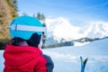 View from behind - girl sit in snow with small mountain ski Royalty Free Stock Photo