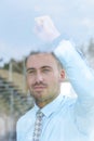 View from behind glass.businessman looking out the window of the office. Royalty Free Stock Photo