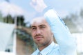 View from behind glass.businessman looking out the window of the office. Royalty Free Stock Photo