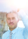 View from behind glass.businessman looking out the window of the office. Royalty Free Stock Photo