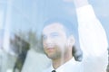 View from behind glass.confident businessman looking out the window of his office Royalty Free Stock Photo