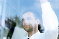 View from behind glass.confident businessman looking out the window of his office Royalty Free Stock Photo