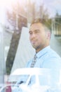 View from behind glass.confident businessman looking out the window of his office Royalty Free Stock Photo