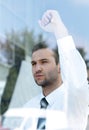 View from behind glass.confident businessman looking out the window of his office Royalty Free Stock Photo