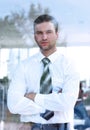 View from behind glass.confident businessman looking out the window of his office Royalty Free Stock Photo