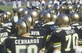 View from behind of group of college football players watching game from sidelines, West Point, NY Royalty Free Stock Photo