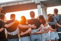 View from behind. Group of young cheerful friends having fun together. Party outdoors Royalty Free Stock Photo