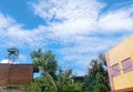 The view behind the house is accompanied by blue sky