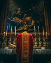 Low Mass in red vestments at the altar of the Nativity Royalty Free Stock Photo