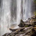 View from behind a tranquil waterfall of Huai Luang Waterfall