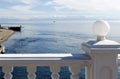 The view from behind the white fence on the source of the Angara River flowing from Lake Baikal