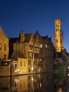 View of the Belfort and one of the canals of Bruges at night (Belgium)